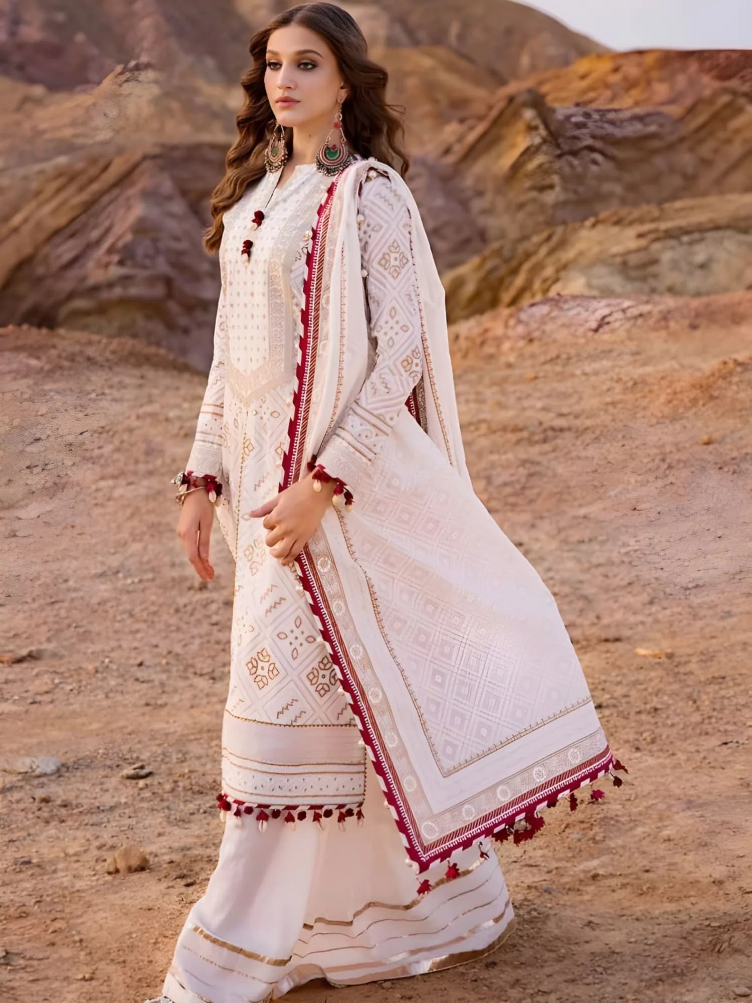 Full-length view of 3-piece lawn suit showing shirt embroidery and dupatta pom-pom finish